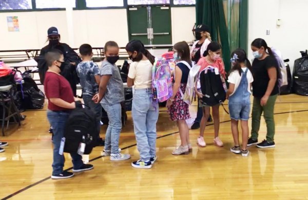 These Stratford School students had a big surprise waiting them as a Valley farming group, Sandridge Partners, donated new backpacks filled with school supplies.